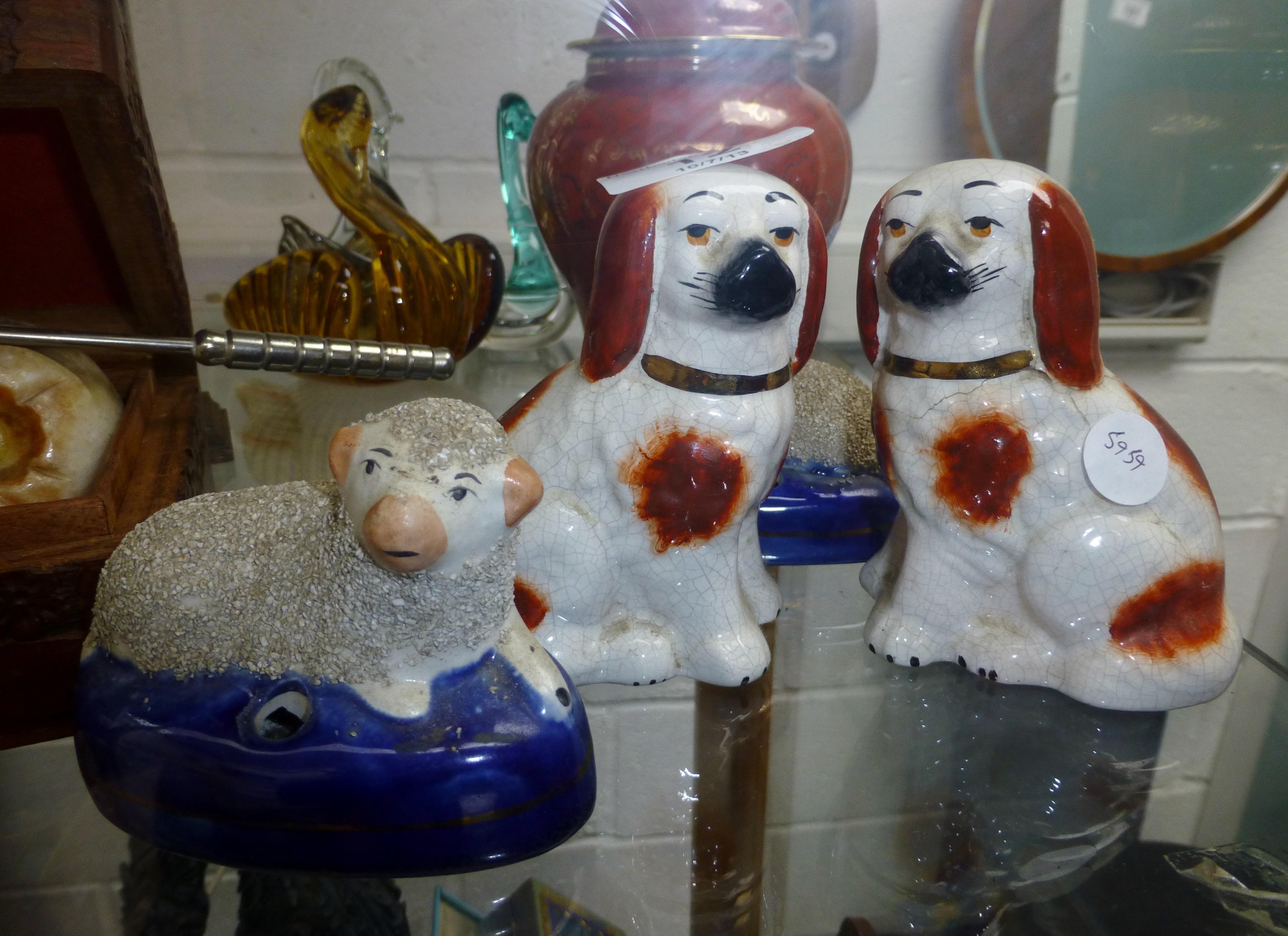 Two Staffordshire sheep ( one a/f ) and two small Staffordshire dogs ( one a/f )