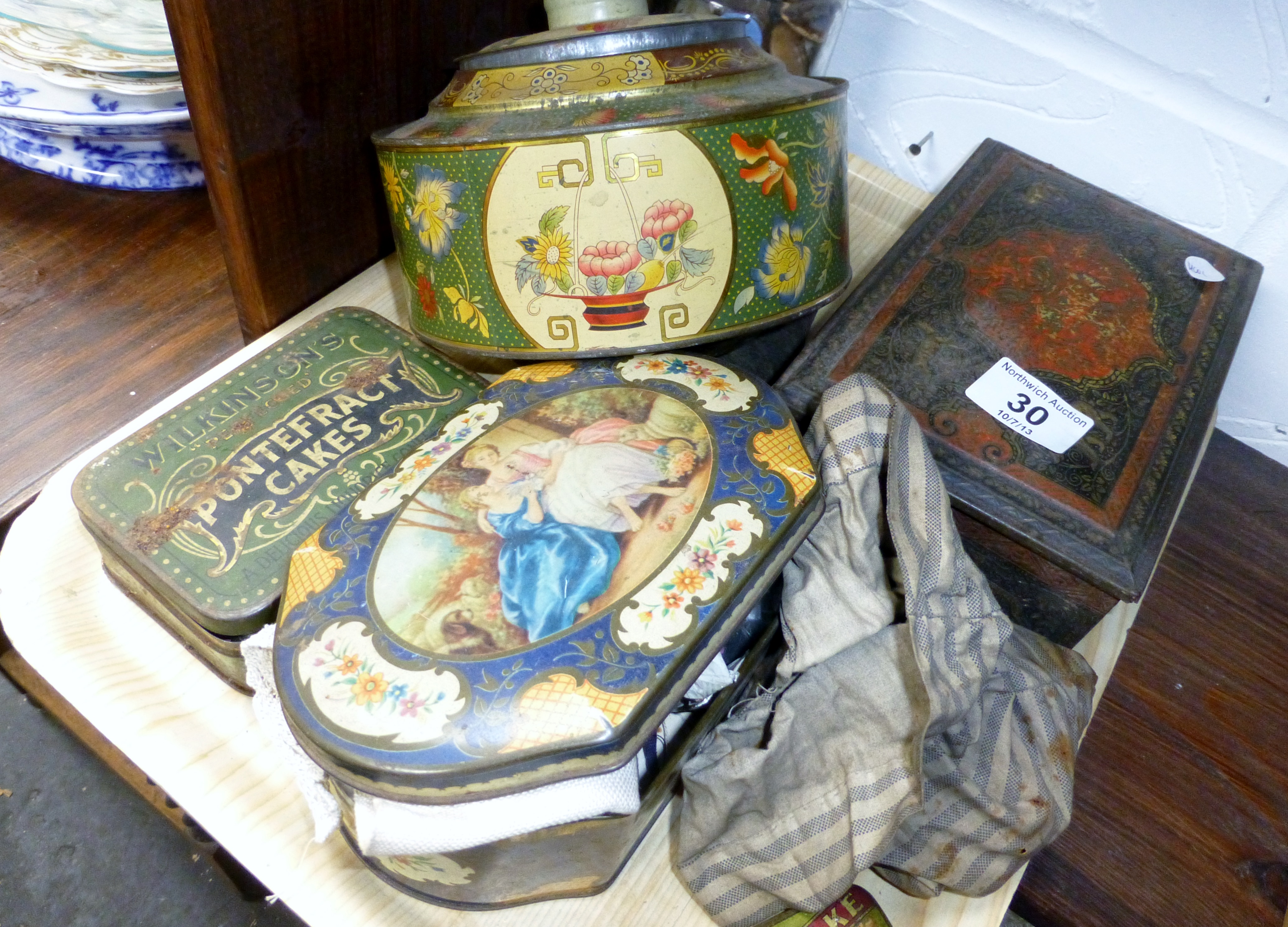 Tray of vintage tins containing sewing items