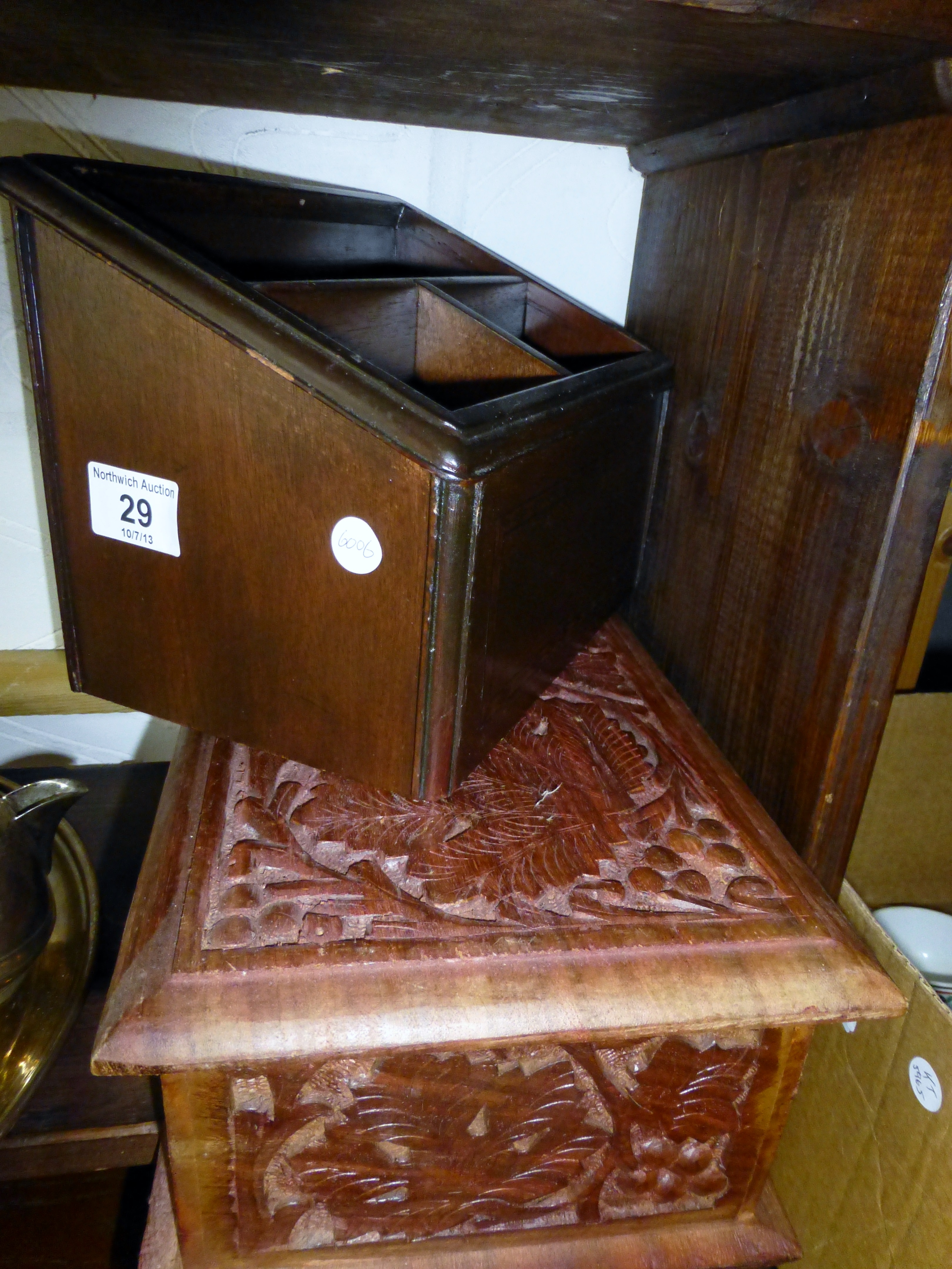 Carved wooden box with contents and a desk tidy