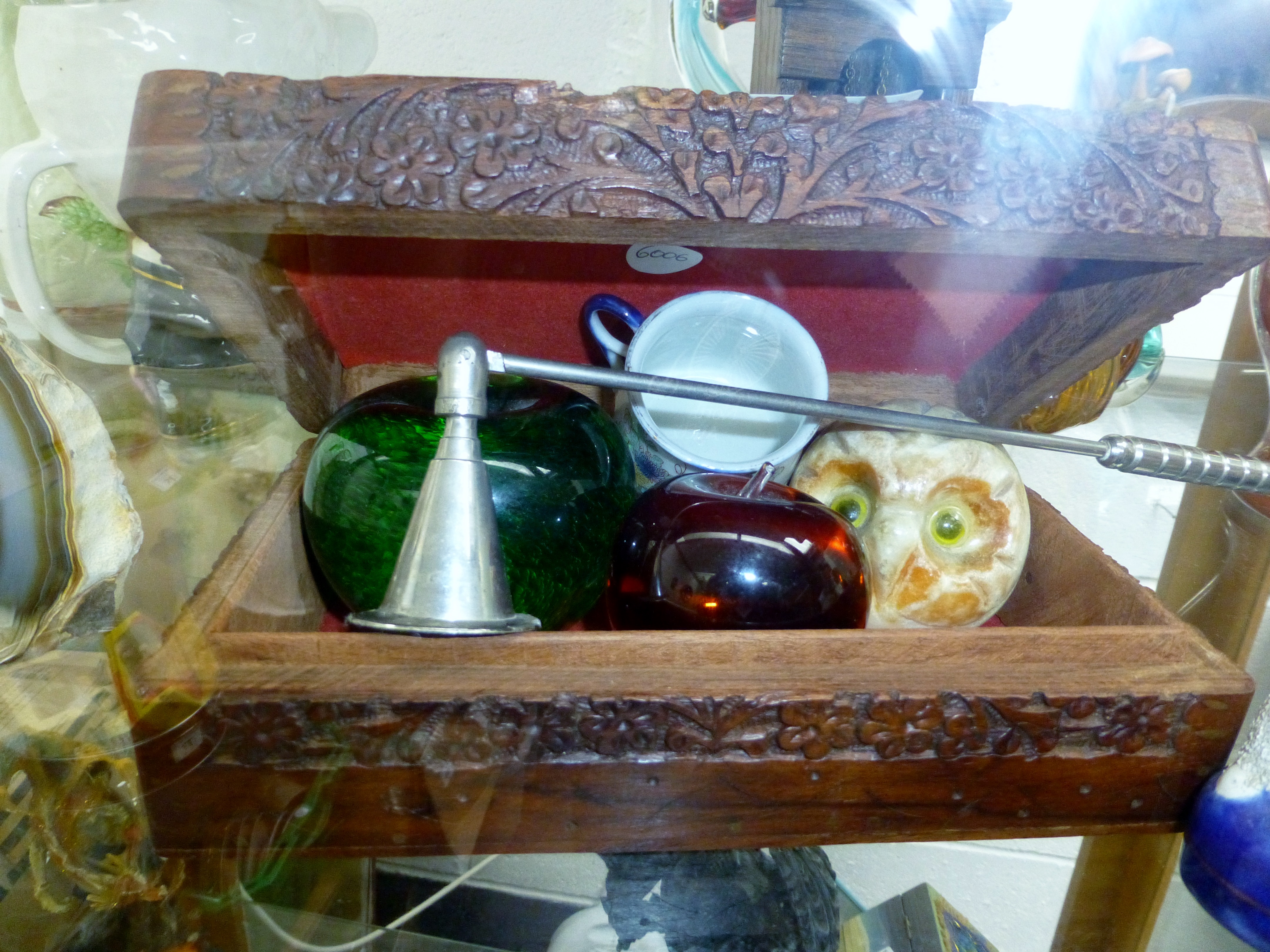 Carved box containing paperweights