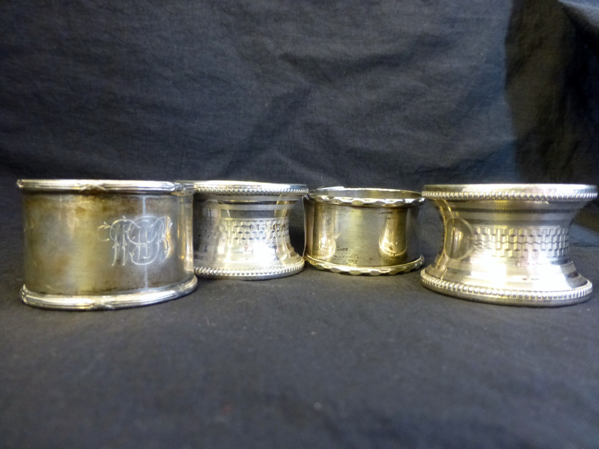 Four hallmarked silver napkin rings different hallmarks, 69g