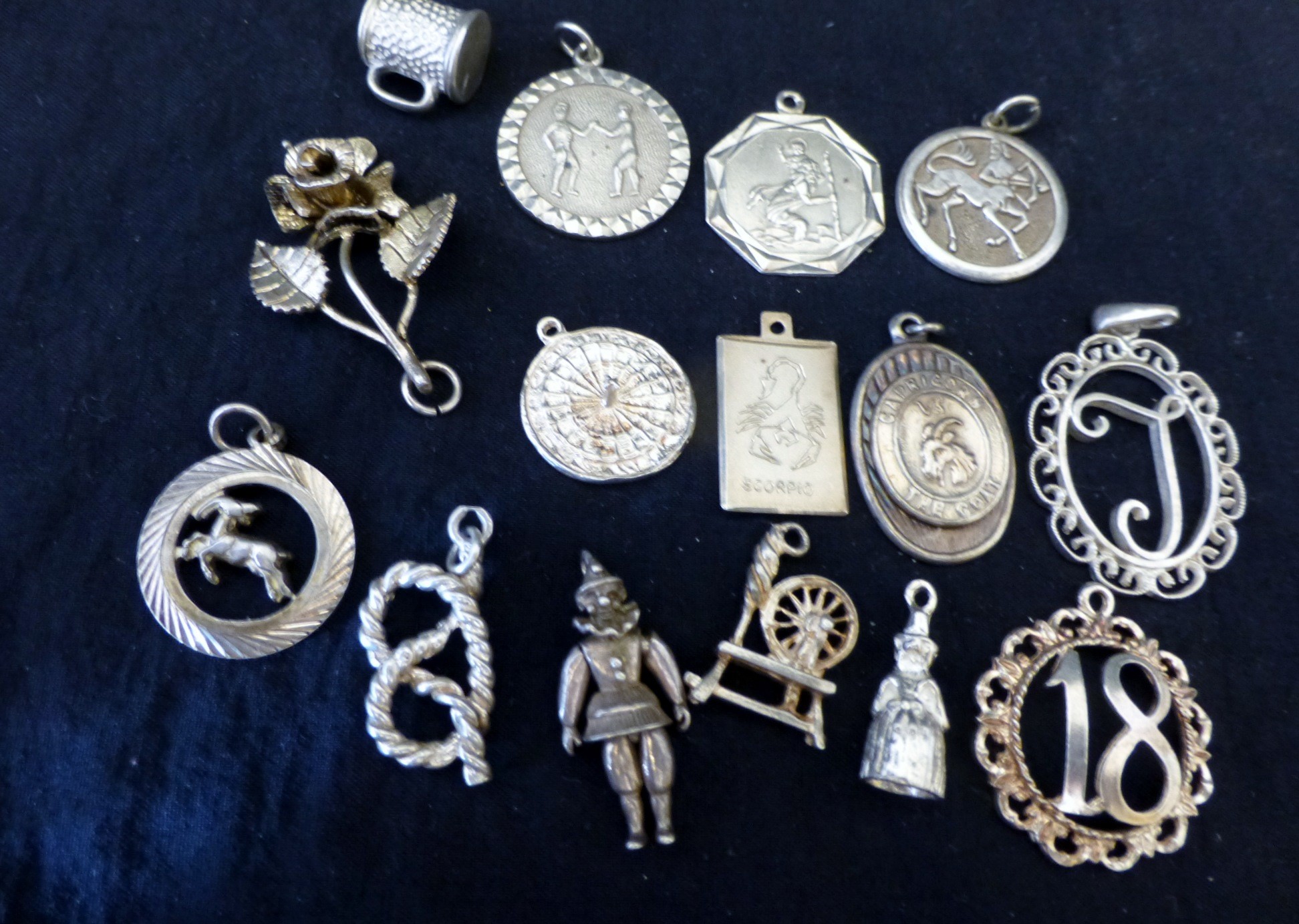 Bag of sterling silver charms and pendants  AS6