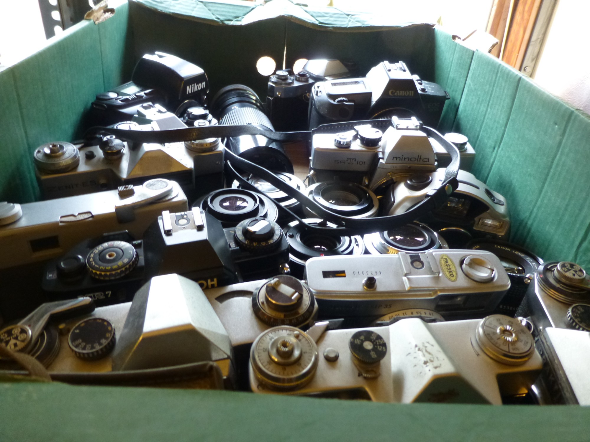 Box of cameras and lenses