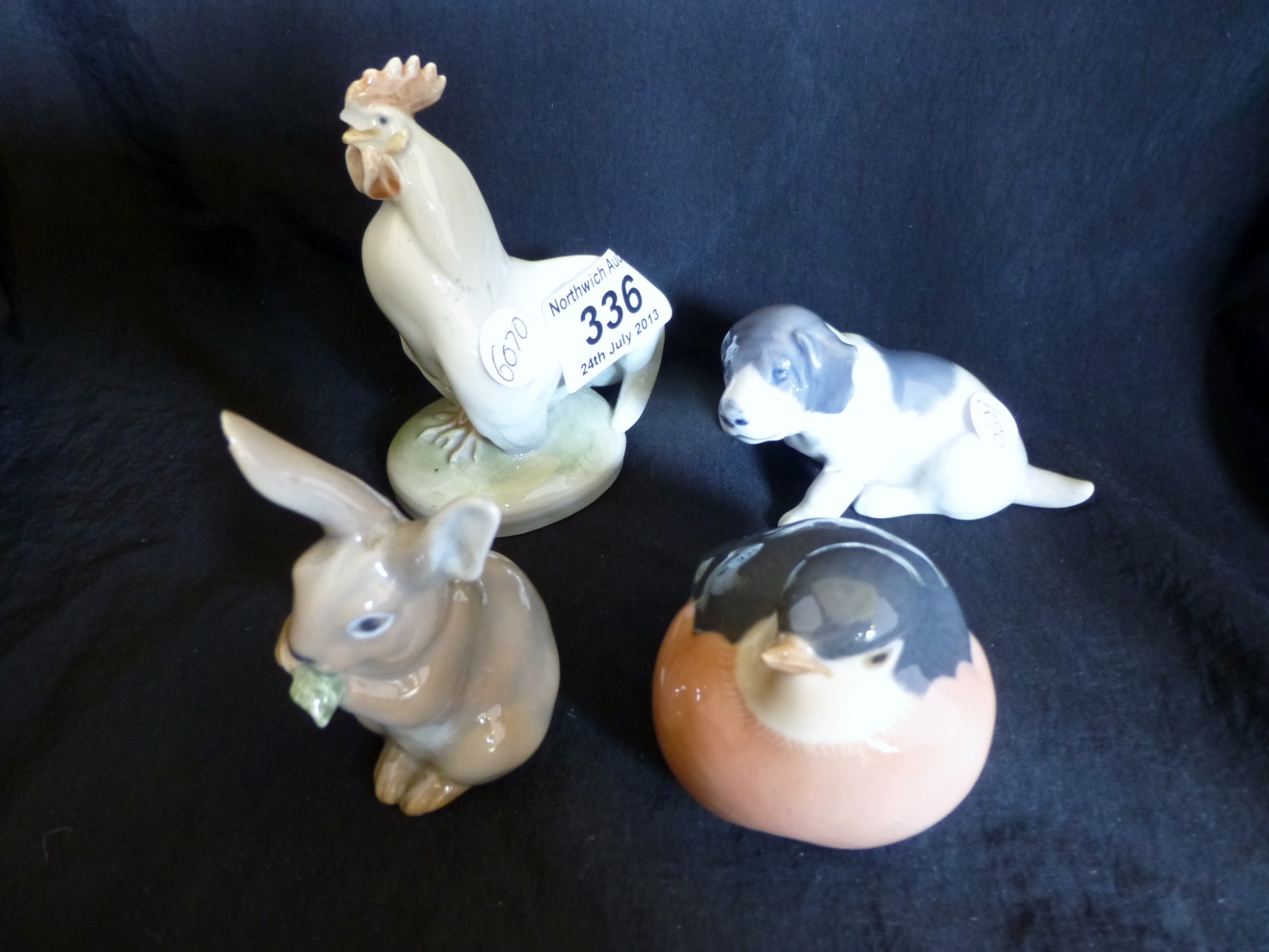 Four Royal Copenhagen figures of animals, rabbit, dog, bird and cockerel