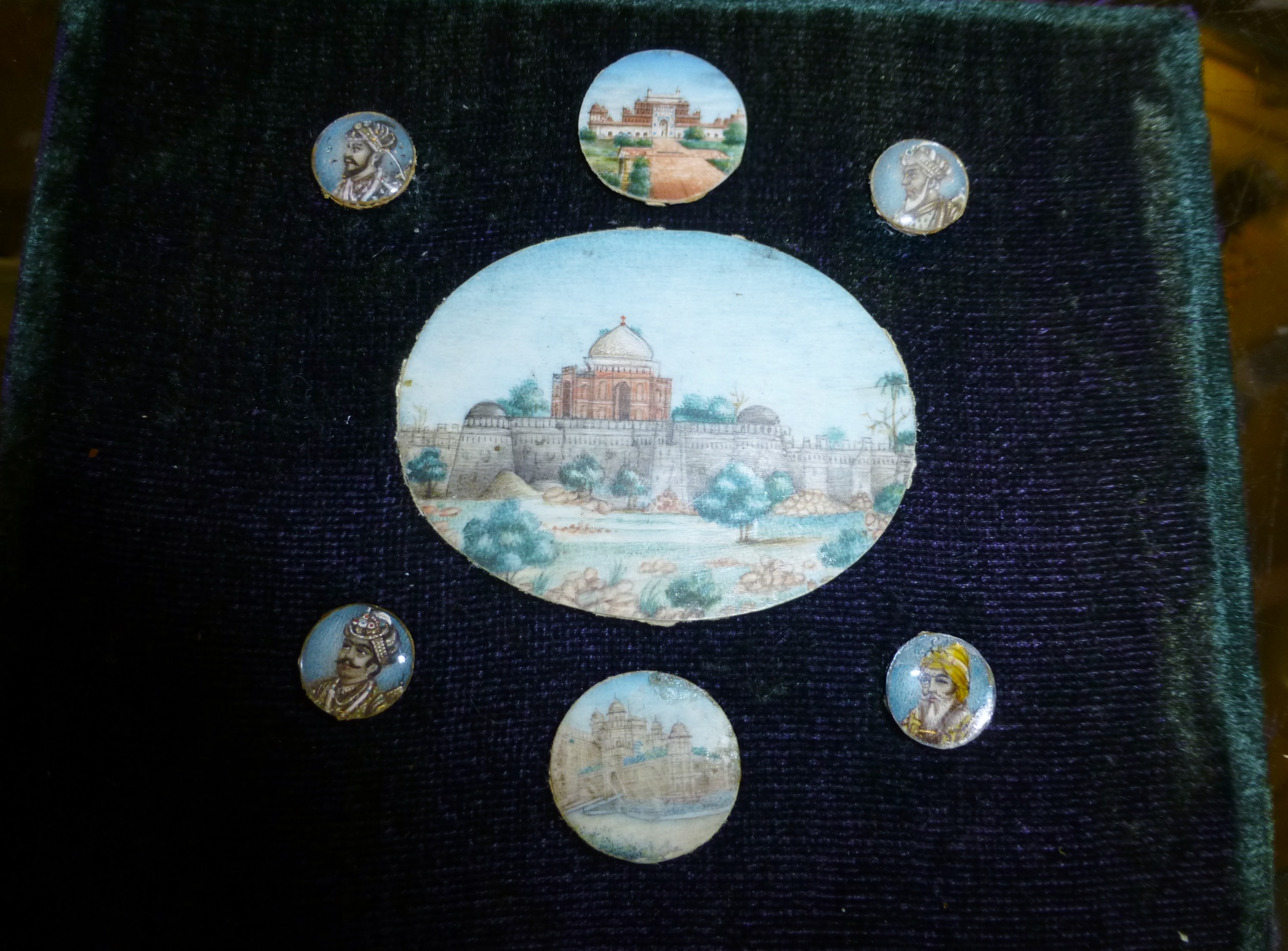 Indian hand painted on ivory, three local scenes and four encapsulated individuals