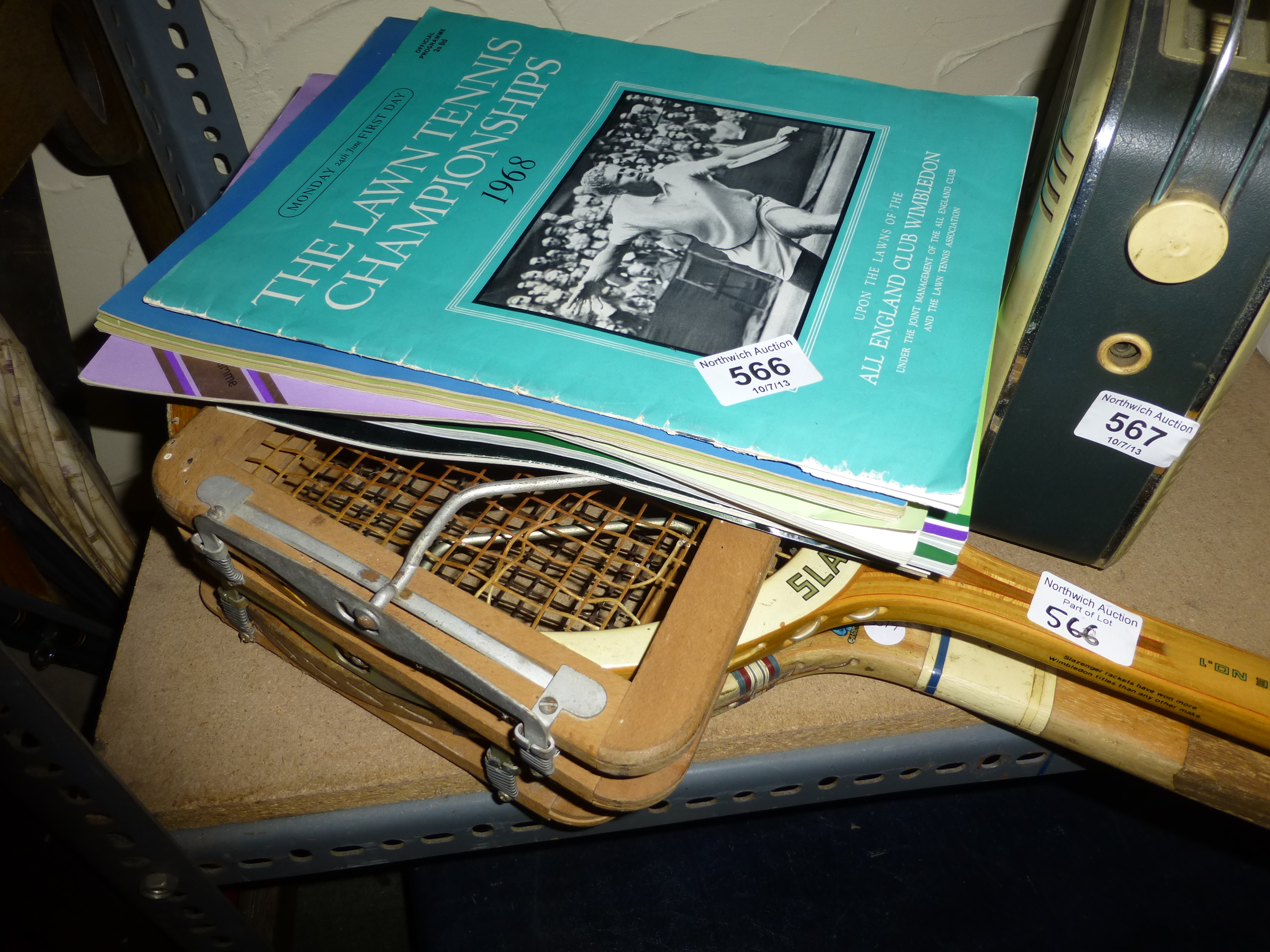 Two vintage tennis rackets and Wimbledon programmes