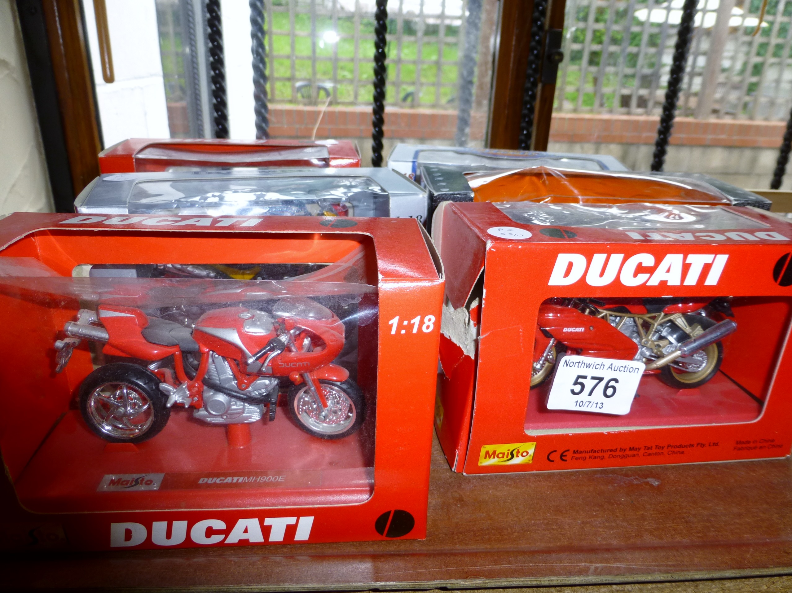 Tray of boxed model motorcycles