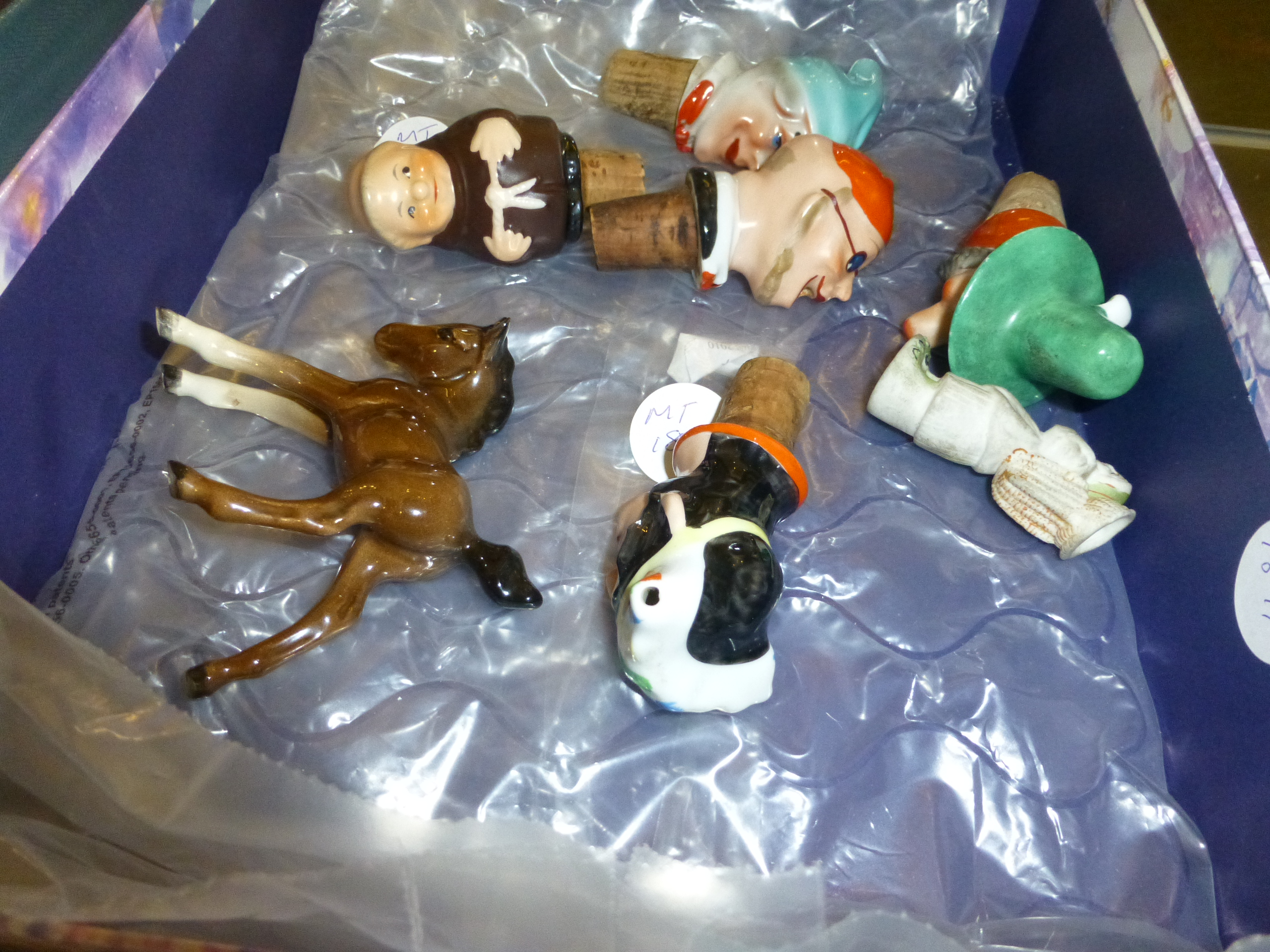 Box of ceramic bottle stops and a Beswick foal