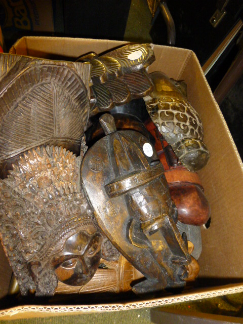 Box of carved wooden masks etc