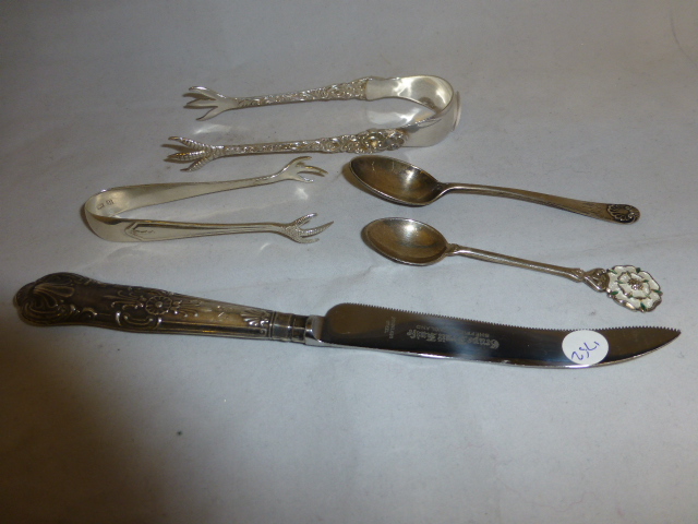 Box of hallmarked silver items and a pair of silver plated sugar tongs