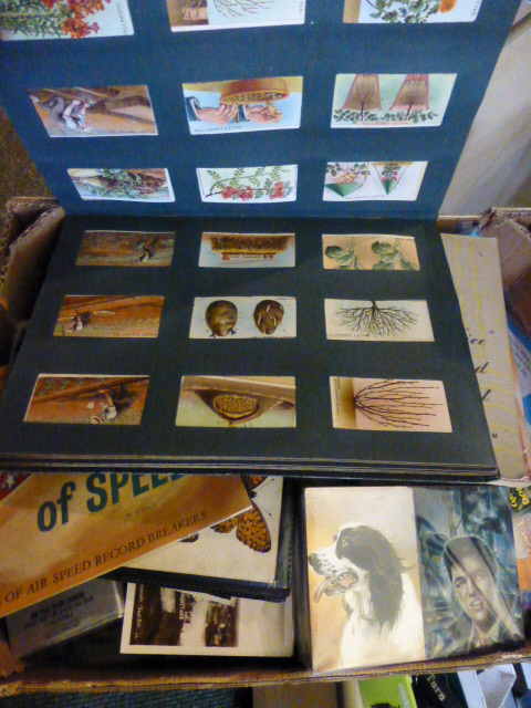 Large box of ephemera and music sheets to include cigarette cards and trade cards