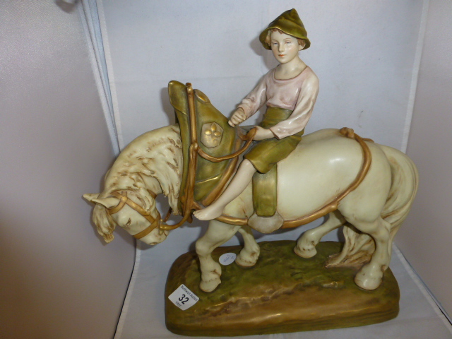 Royal Dux figure of a boy riding a horse in harness, 36cm tall ( on the windowsill )