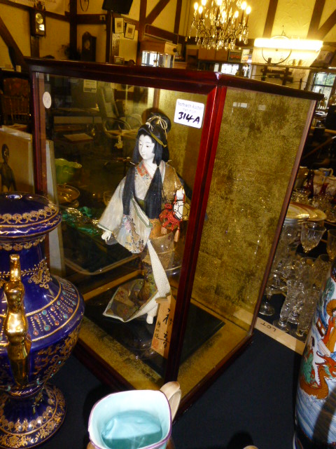 Japanese Geisha doll in glass case