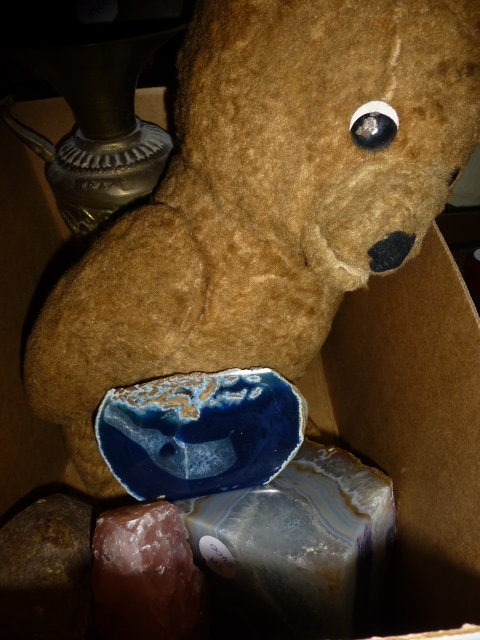 Box of mineral stones, teddy bear and a vase