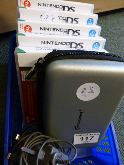 Nintendo DS with four games and charger