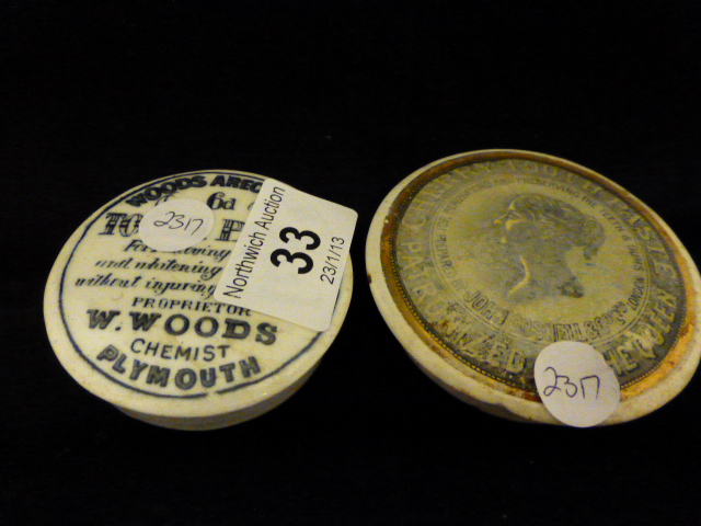 Two Prattware pot lids, cherry tooth paste and Woods areca nut toothpaste