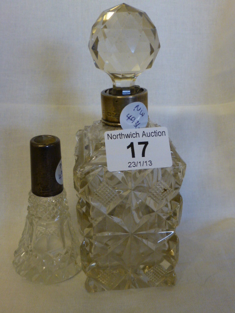 Cut glass decanter with hallmarked silver collar and a cut glass hallmarked collared scent bottle