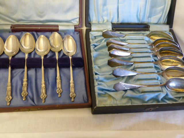 Cased set of six silver plated apostle teaspoons and cased set of six silver plated teaspoons