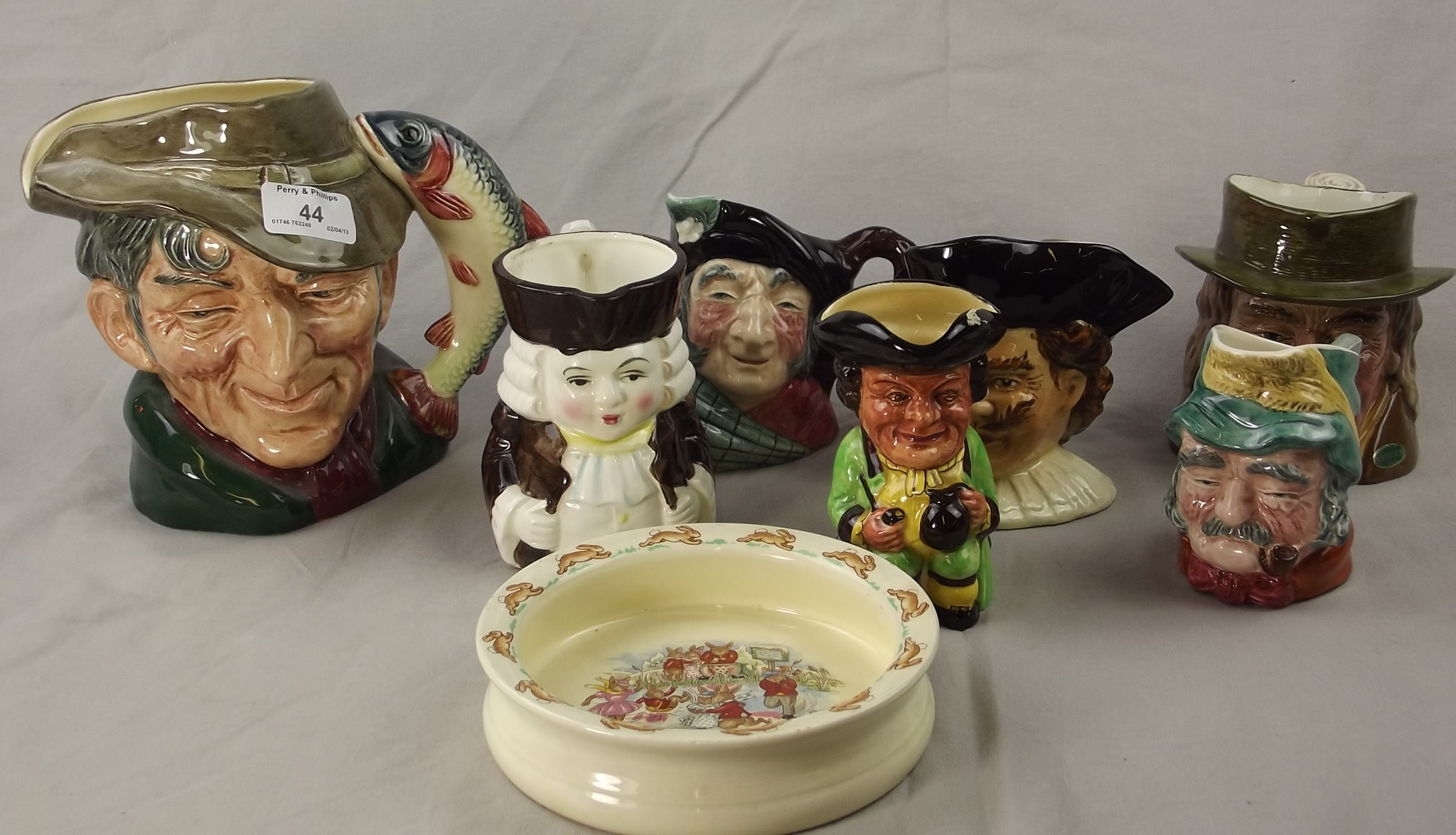 A Royal Doulton Toby Jug "The Poacher" D6429 and Six Other Toby Jugs and a Bunnykins Bowl.