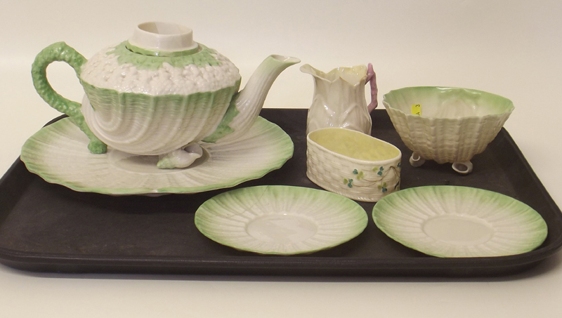 Belleek tea pot, cake plate, bowl, two saucers, a jug and a dish.