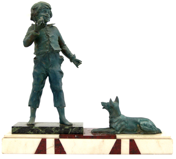 Art deco style figure group of a green patinated spelter ragged boy and a dog, on a red and white