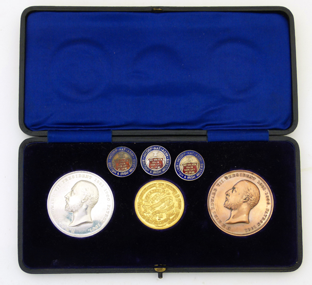 Cased set of three gold silver and bronze prize medals : an 18ct gold medal for excellence in