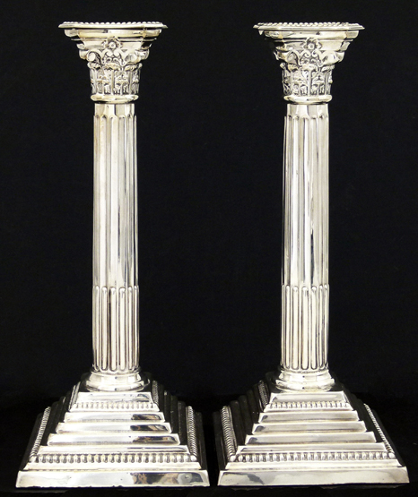 Pair of weighted silver Corinthian column candlesticks , DJS, London 1962 . the fluted stem on a