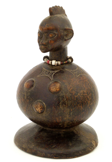 Yoruba maternity figure, late 20th century, with a globular body and bead necklace, height 25cm.