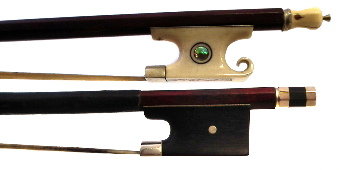 Two Violin bows the first with carved ivory and abalone frog, the second stamped Bausch (2) 74.5cm