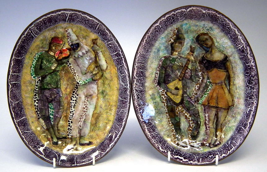 Pair of Italian oval enamel dishes decorated with Harlequins, painted `Artistica Comunita Torino