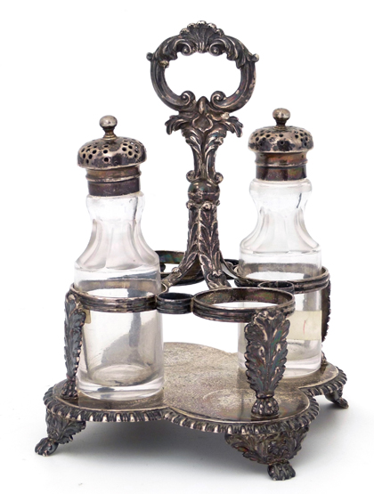 George III silver cruet stand , London 1821 , of quatrefoil shape decorated with leaves, together