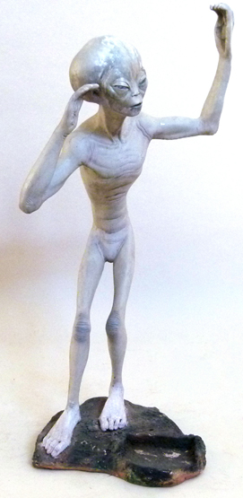 Composition standing figure of the Roswell alien moulded on the base © AAA, height 125cm.