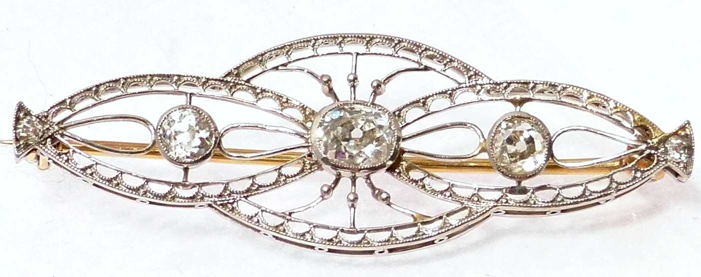 Platinum and diamond brooch circa 1910, of three open work conjoined ovals set with three old mine