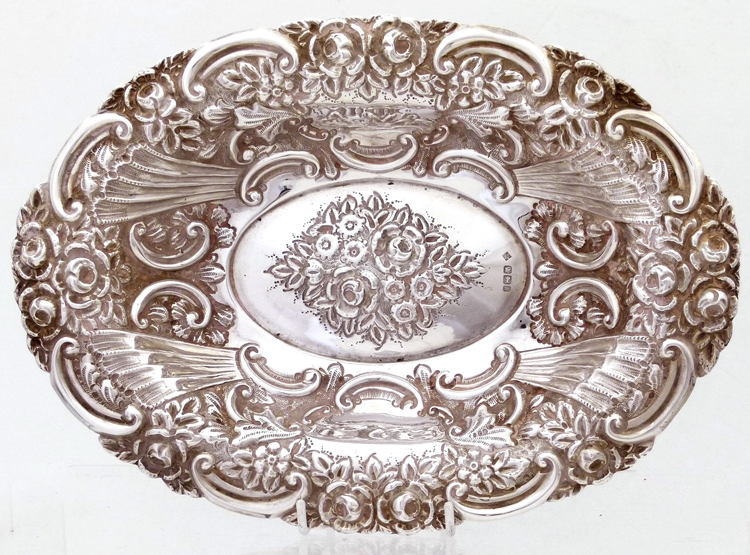 Oval silver dish ,Hall & Co, Sheffield 1900 , embossed with scrolls and flowers, length 27cm, 8oz