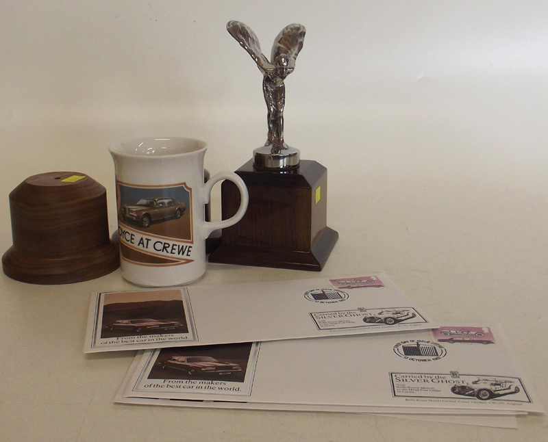 Rolls Royce Spirit of Ecstasy mascot on plinth, two other plinths and two first day cover Rolls