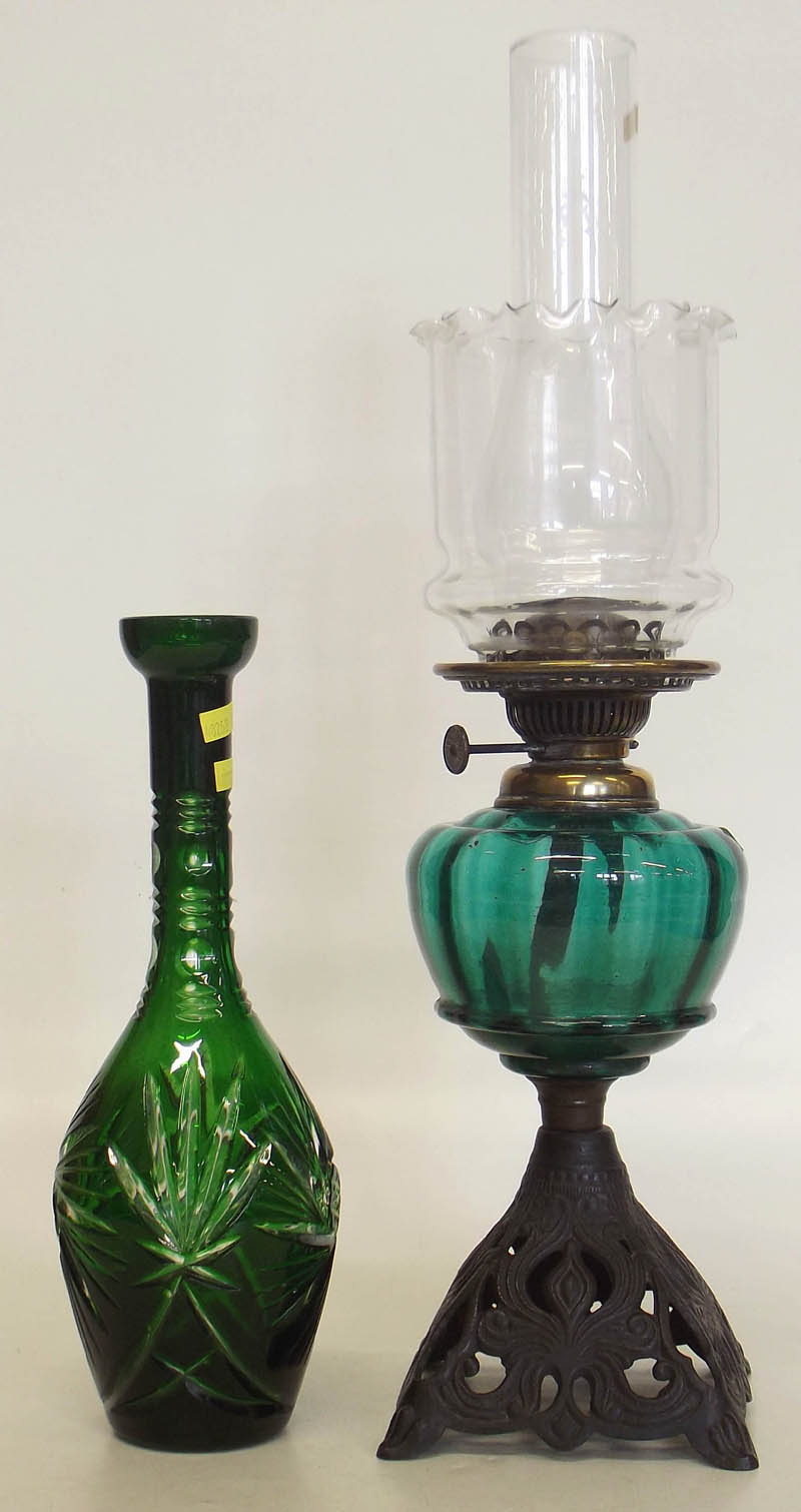 Victorian oil lamp and green decanter.