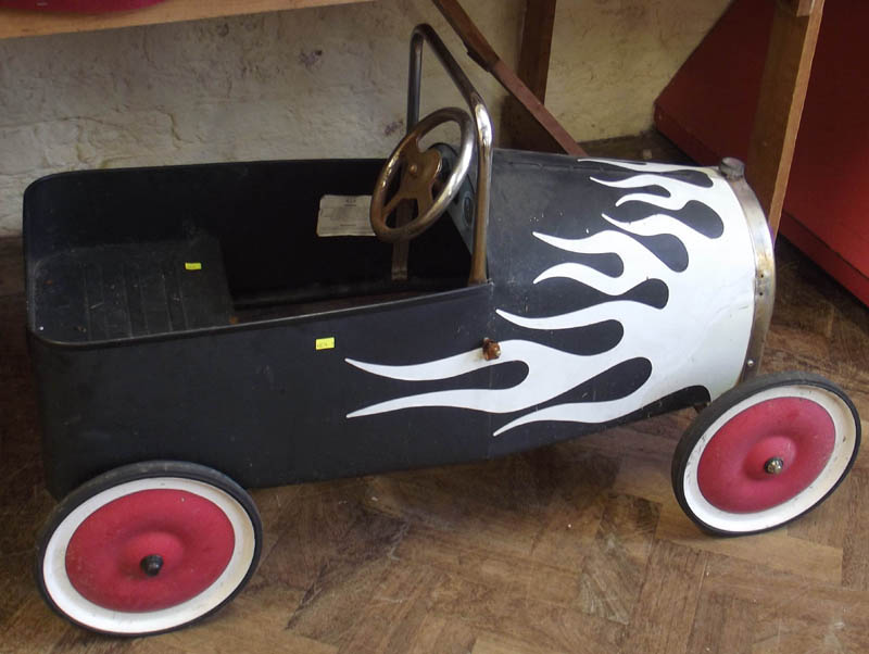 Metal toy pedal car.