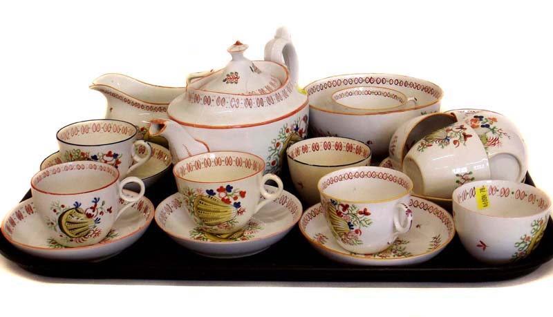 Composite part tea service circa 1830 decorated with shells, the slop bowl marked Newhall.