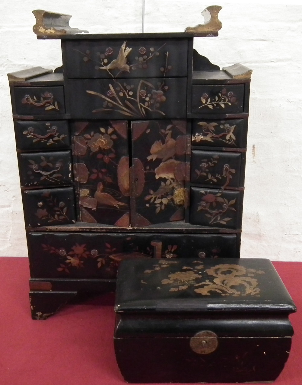 Japanese black lacquered table top cabinet and a similar tea caddy (2).