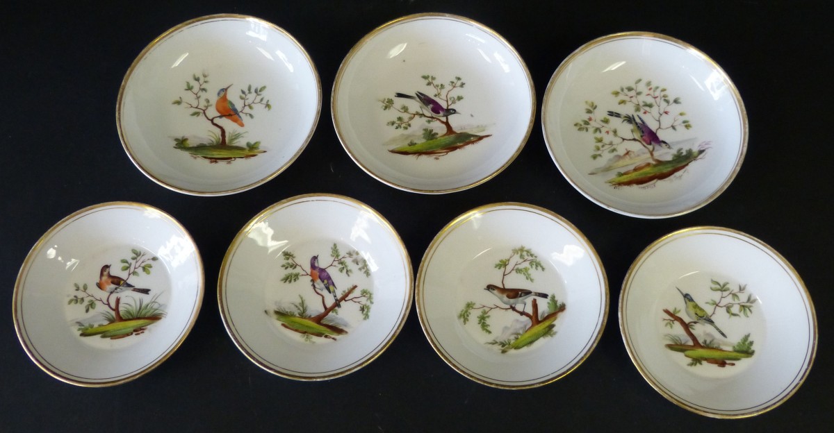 A Set of 3, 19th Century Porcelain Saucers having multicoloured hand painted bird decoration, also 4