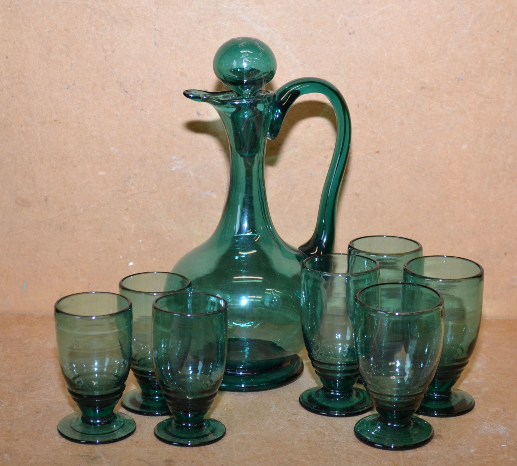A Green Glass Bulbous Claret Jug with stopper, also 7 various 2 sized tumblers (8)