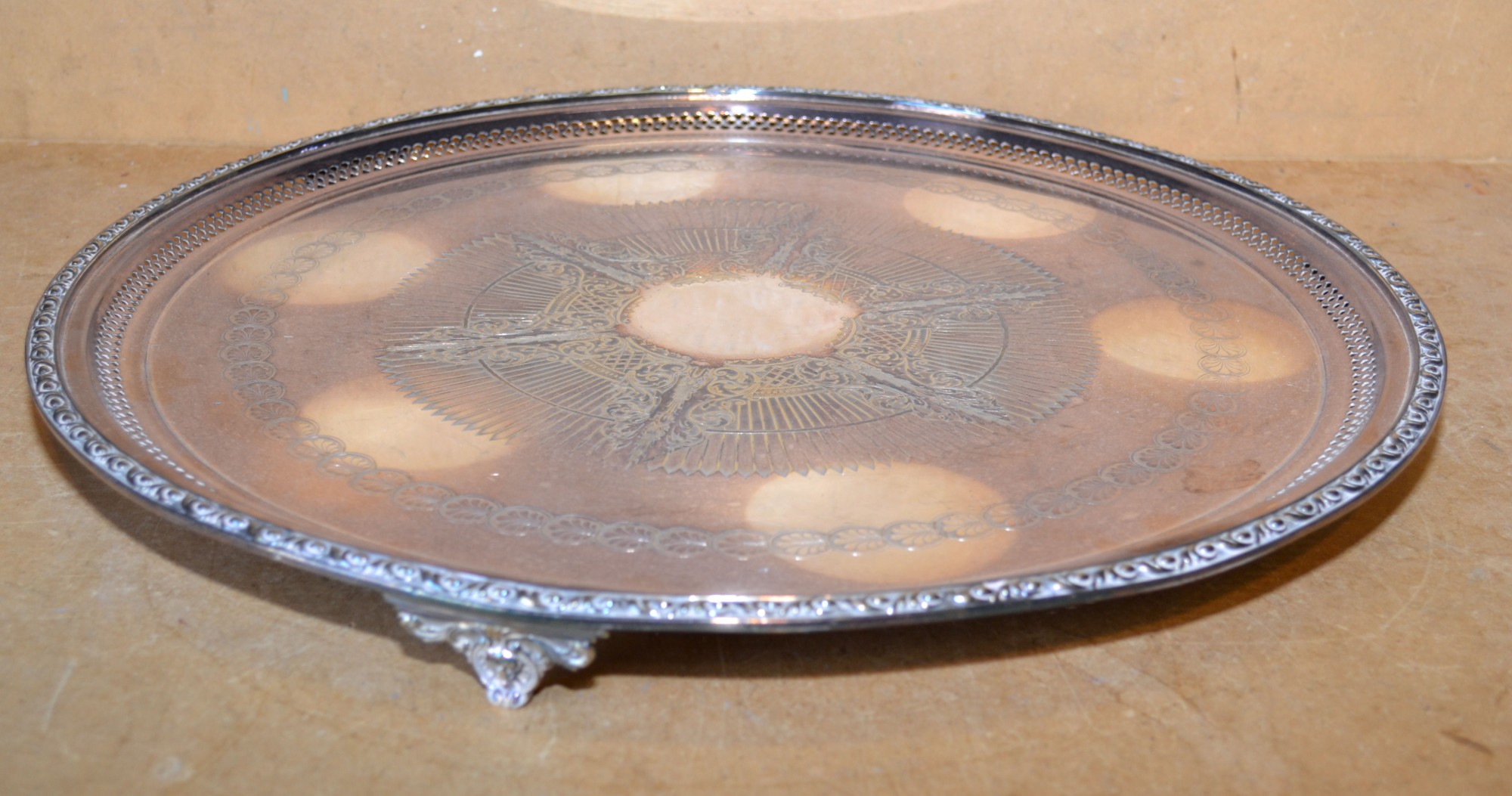 A Silver Plated Large Round Salver having raised and pierced rim with chased centre on 3 splayed