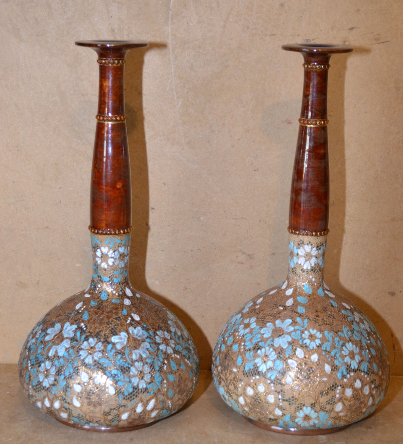 A Pair Royal Doulton Stoneware Bulbous Thin Necked Trumpet Shaped Vases on brown and gilt ground