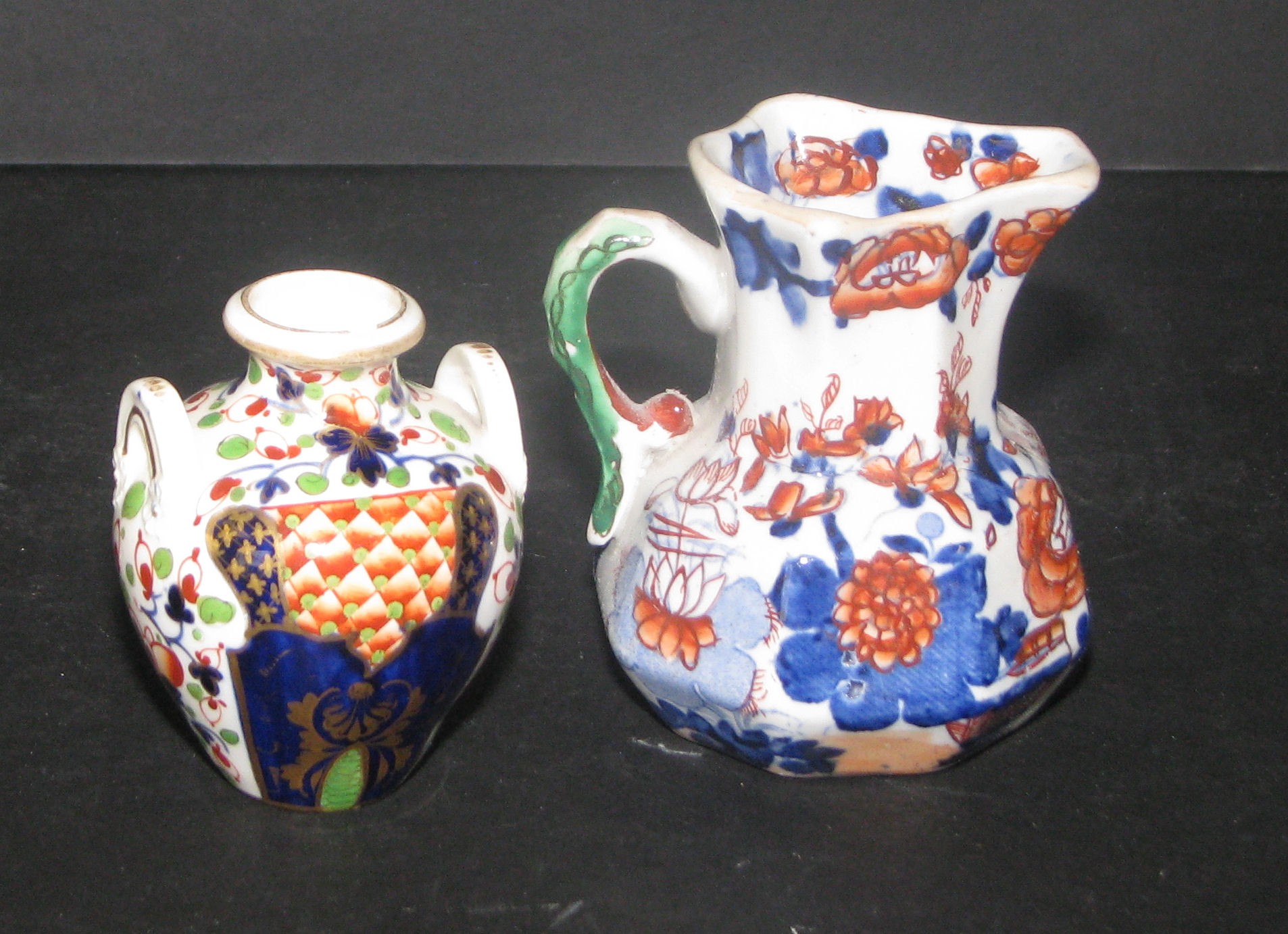 A 19th Century Small Bulbous Thin Necked 2-Handled Vase having Imari pattern decoration, 8cm high;