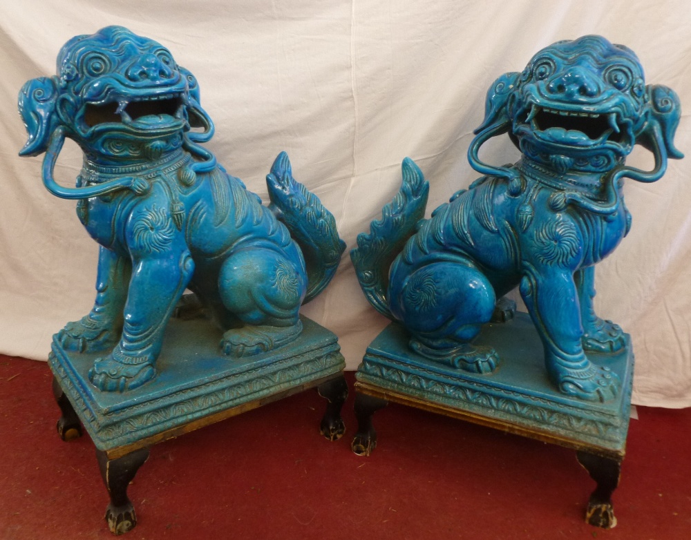 A pair of ornate Italian 1960's turquoise glazed pottery figures of Chinese dogs of foe seated on