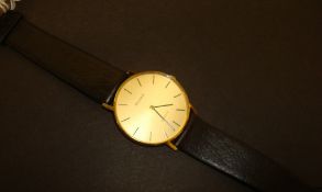 Gent`s Bulova quartz wrist watch with gold case and Bulova leather strap