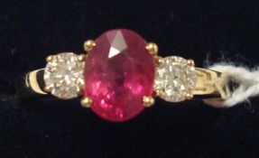 Ruby and diamond three stone ring, comprising central oval-cut ruby, approx 1.50ct, with one round-
