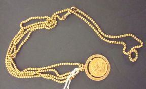 Modern gold sovereign 1966, yellow metal mount on long yellow metal necklace