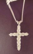 Diamond set cross, comprising 11 matched quality round brilliant-cut diamonds approx total diamond