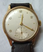 Gents Omega 9ct gold wrist watch with arabic numerals and sub second dial with leather strap